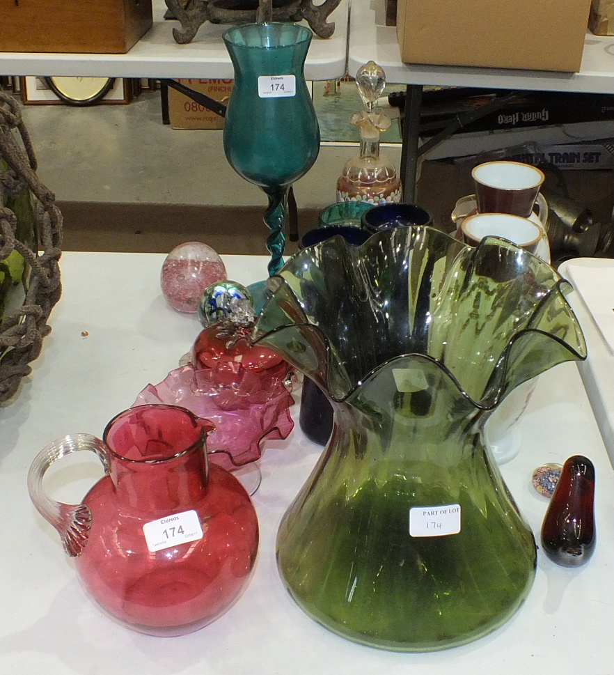 A cranberry glass jug, 18cm high, a cranberry sweetmeat dish with frilled edge and other glassware.