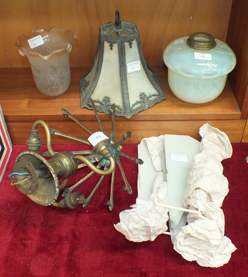 An early 20th century brass and frosted glass light fitting, 23cm diameter, 32cm high, together with