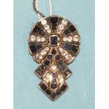 An Art-Deco-style sapphire and white stone dress clip of geometric design, unmarked white metal, 3.