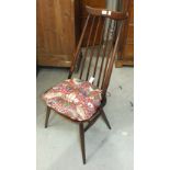 A set of four Ercol dark wood stick-back chairs, (4).