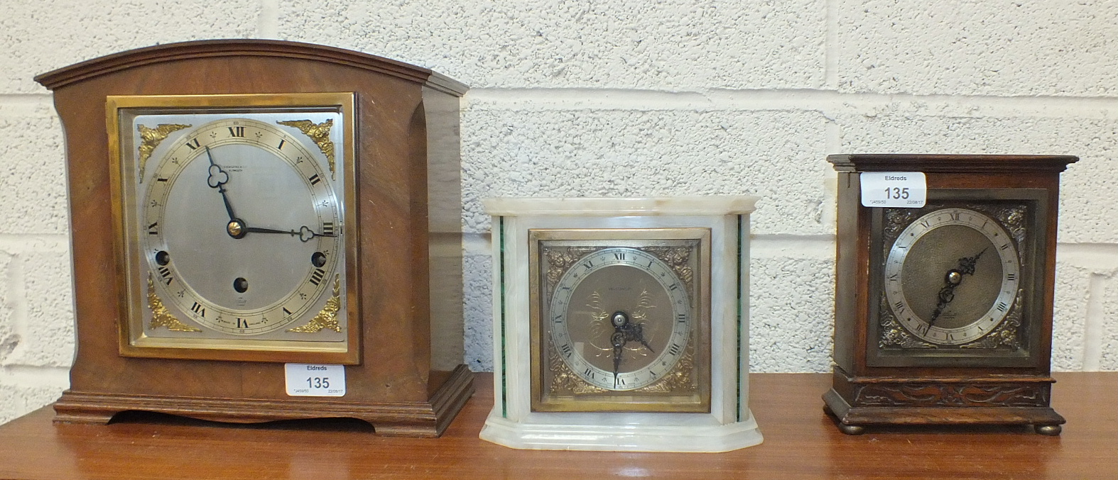 An Elliott walnut cased Westminster/Whittington chiming mantel clock, 23cm high, an Elliott white