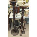 A stained mahogany "bedpost" torchère and two others, (3).