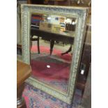 A gilt-framed wall mirror, 79 x 109cm.