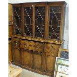 A Georgian-style secretaire/library bookcase by Reprodux, having four astragal-glazed doors over