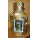 A ship's copper and brass lamp with oil lamp burner and carrying handle, 36cm high.