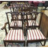 A set of eight reproduction mahogany-framed Chippendale-style dining chairs with pierced slat,