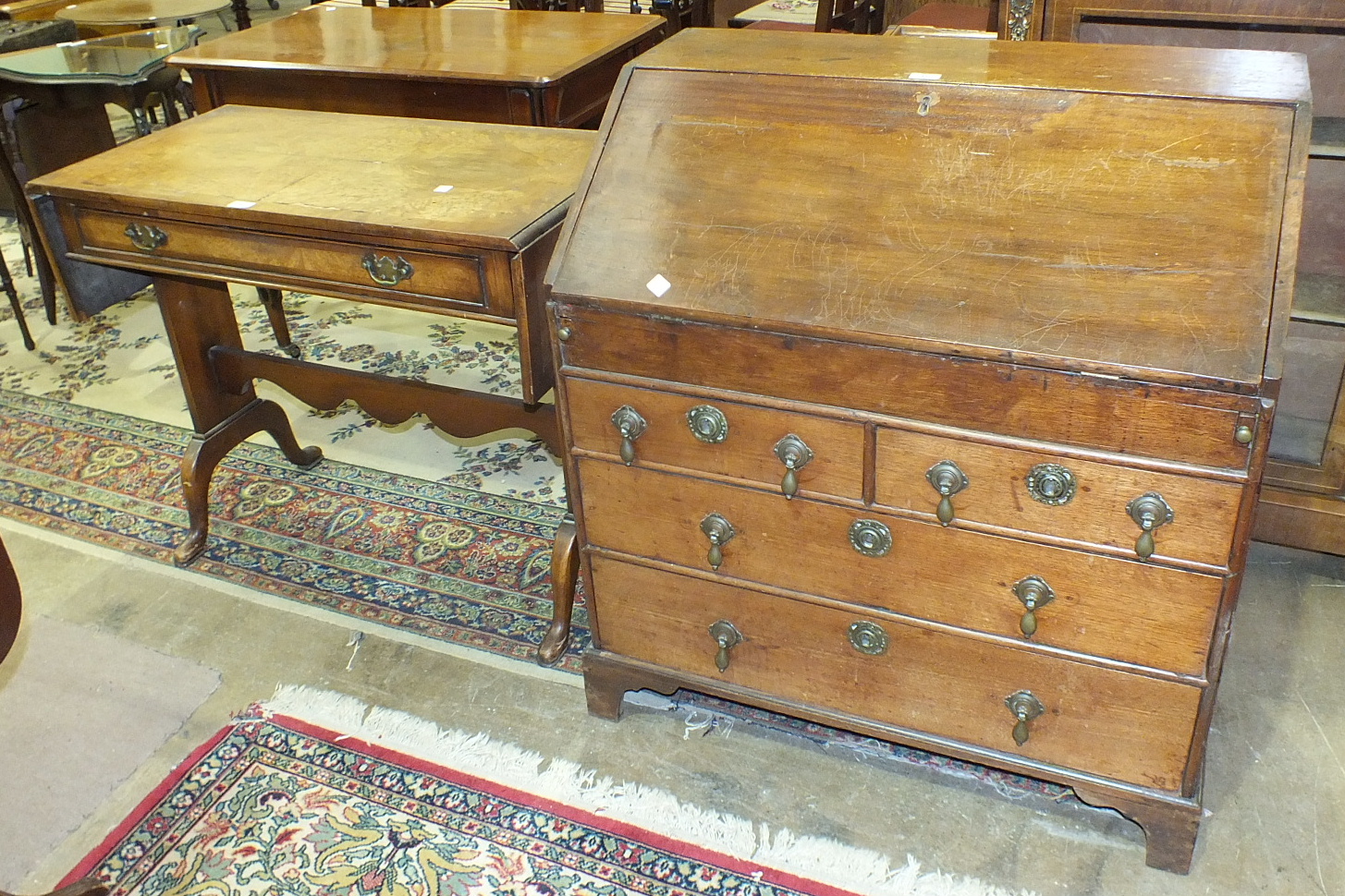 A 19th century mahogany bureau, the rectangular top above a fall front revealing pigeon holes,