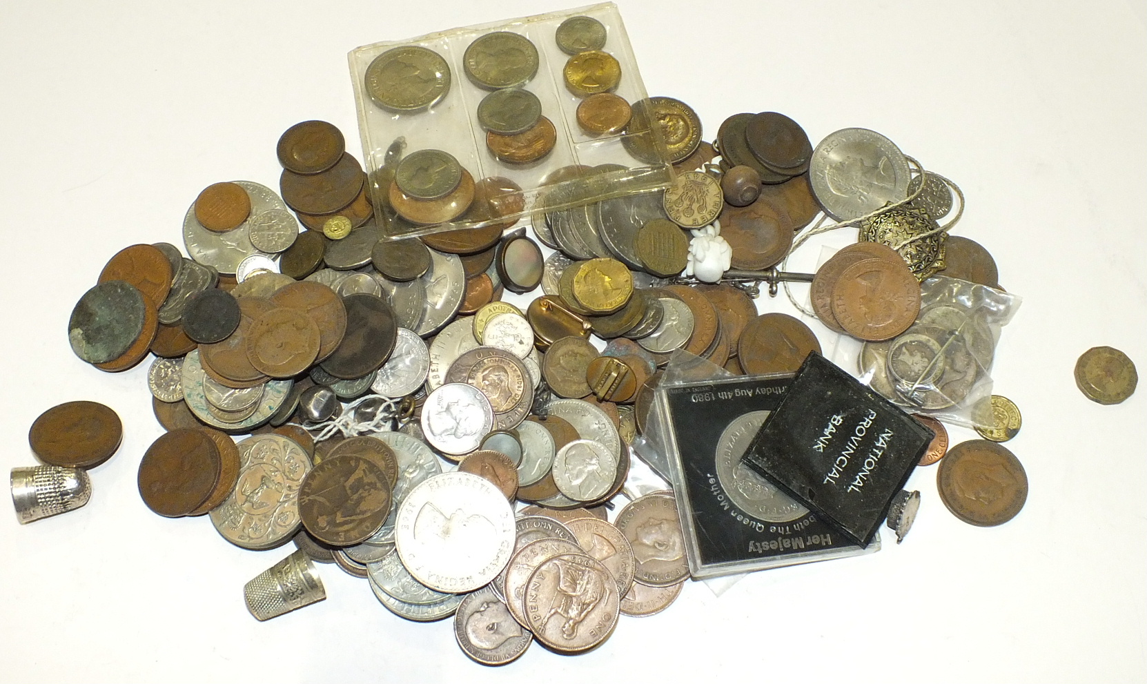 A collection of British and foreign coinage, including a small quantity of pre-1947 silver.