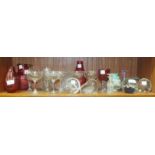 A collection of glassware, including two cranberry glass vases, three cranberry glass wines,