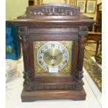 An Edwardian oak-cased mantel clock with German chiming movement, 40cm high.