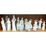 A collection of eleven Nao figure ornaments, two Lladro figures and two other similar figures, (