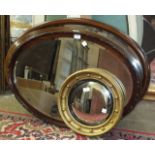 Two inlaid mahogany oval mirrors, one other and a Regency-style circular convex mirror in gilt