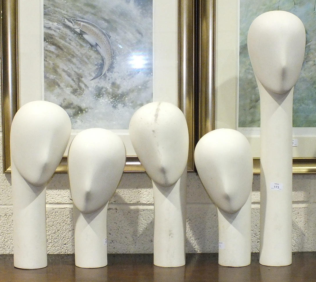 A collection of five glass fibre millinery mannequins with weighted bases, comprising: one straight,