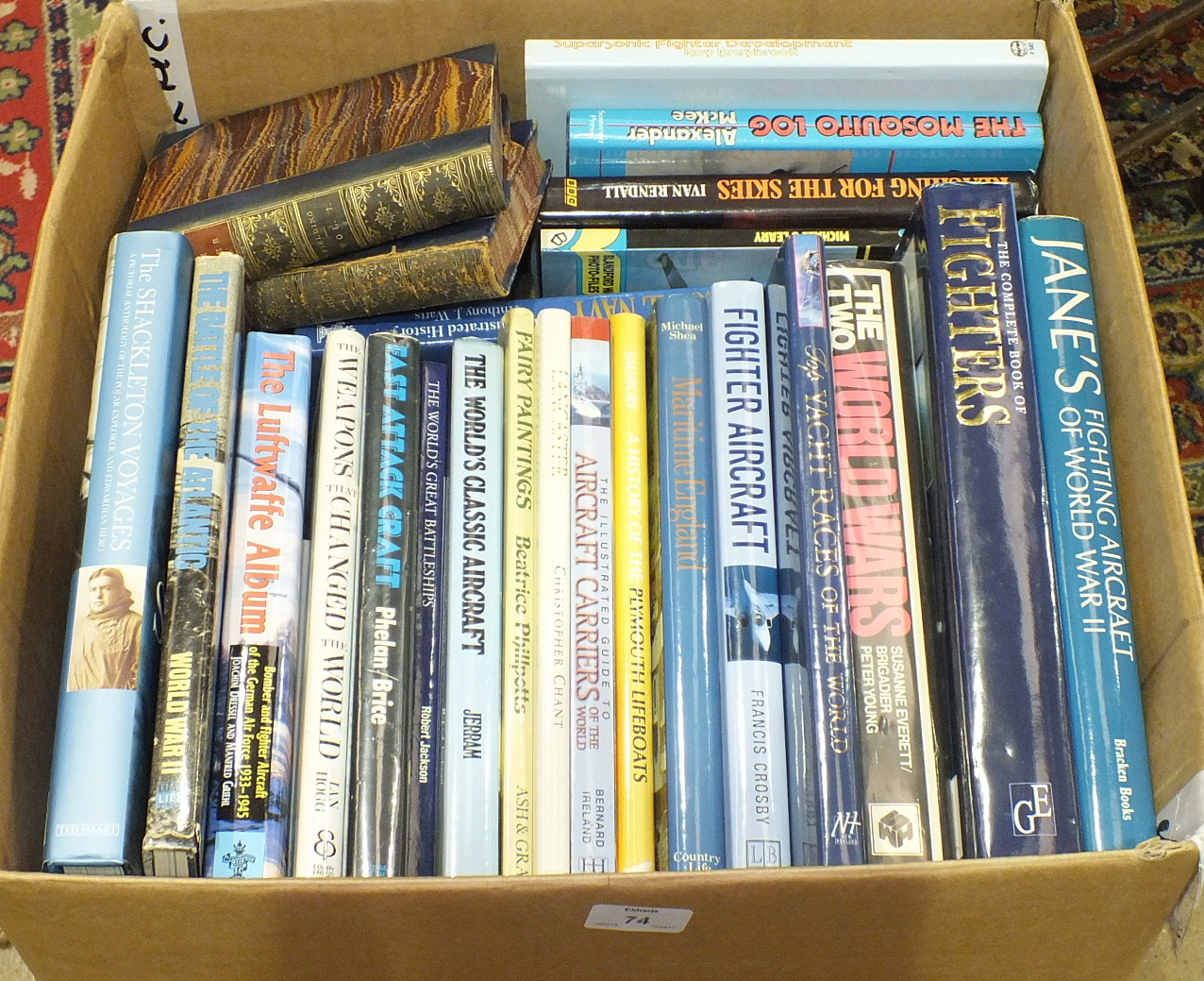 A collection of contemporary hardback books, mainly military and war subjects.