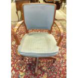 A mid-20th century hardwood swivel office armchair with upholstered back and seat.