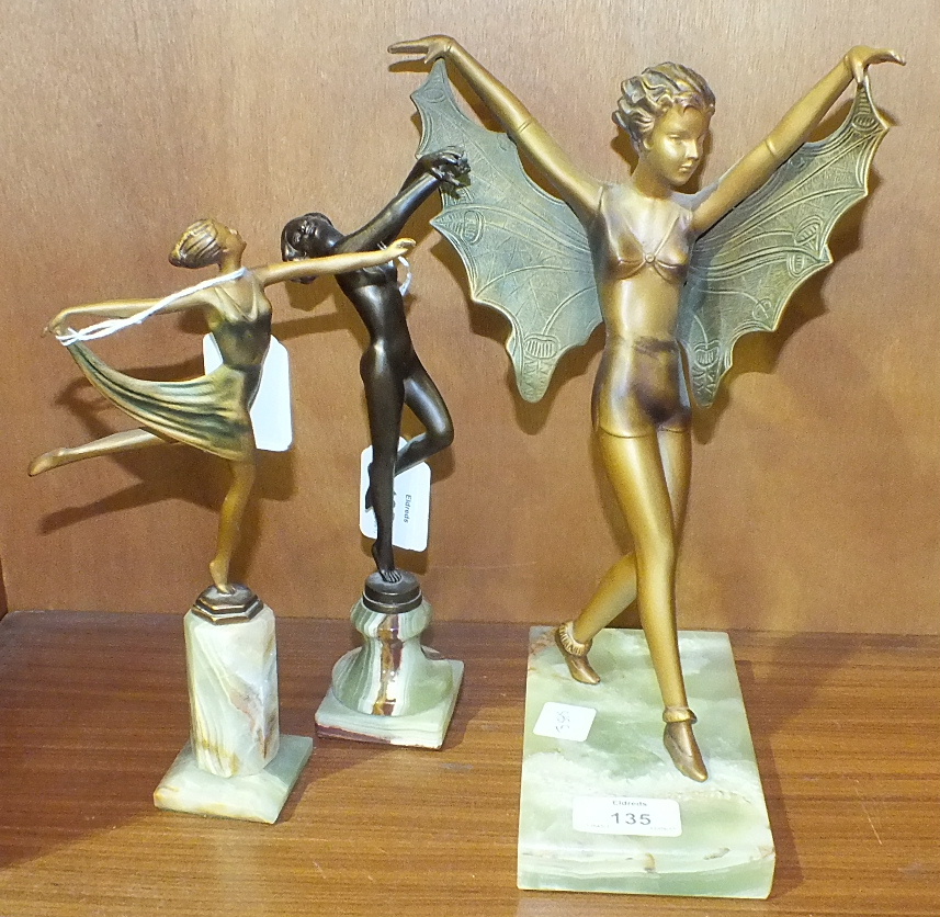 Three modern metal female dancing figures on onyx bases, tallest 27cm high, (3).