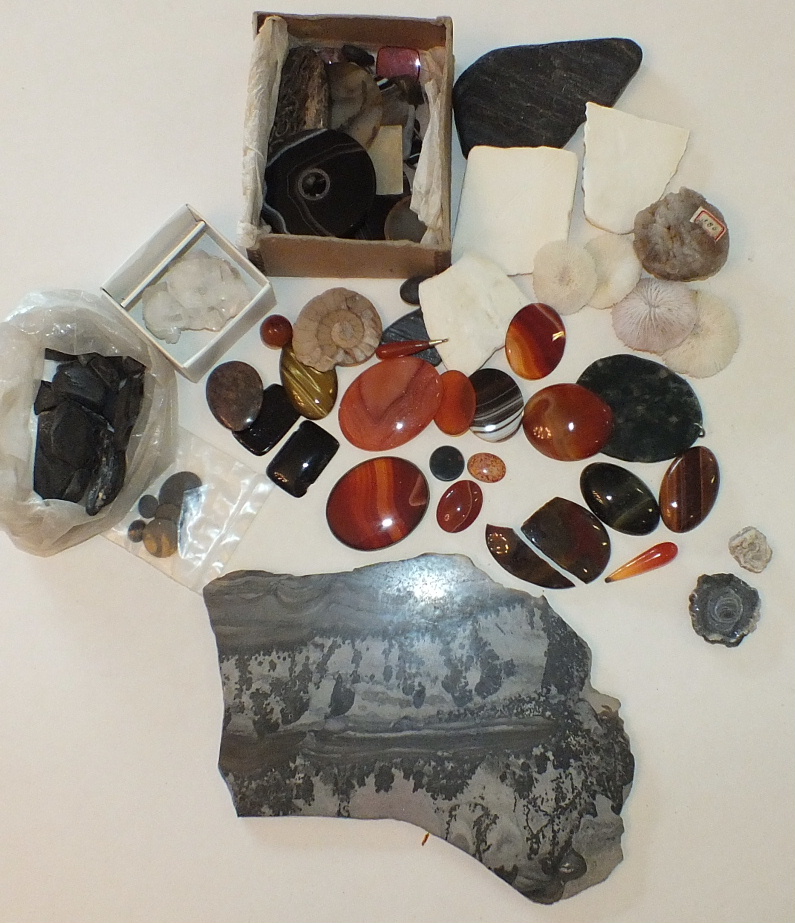 A quantity of polished agate plaques, beads, pendants, etc. and other hard stones.