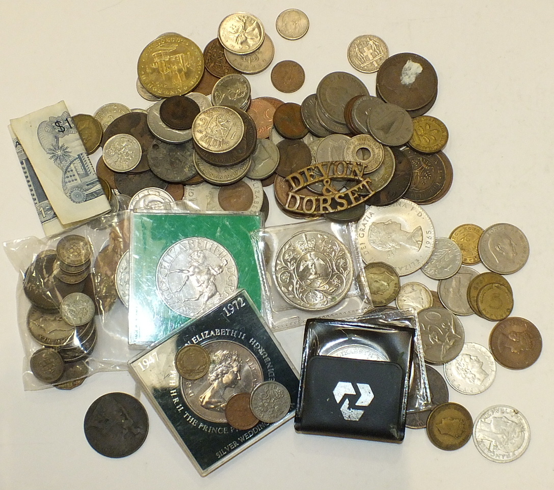 A collection of British and foreign coinage, including a small quantity of pre-1947 silver and a