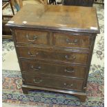 A Williams & Cox, Torquay, small reproduction walnut straight-front chest of two short and three