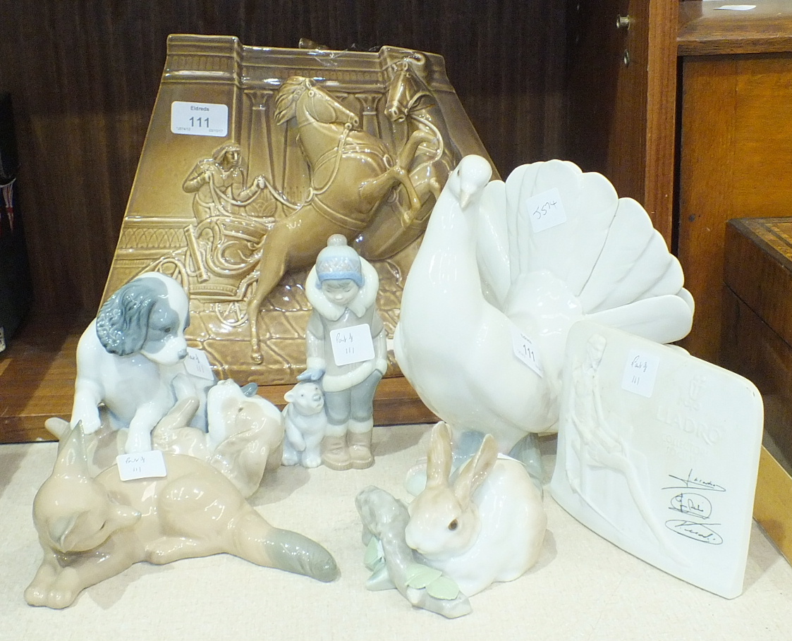 A Lladro figure of a dove, 21cm high, a Lladro rabbit no.4772, a Lladro Eskimo girl with polar