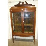 An Edwardian inlaid mahogany display cabinet, the rectangular top with swan neck back, above a