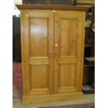 A modern pine two-door wardrobe, 131cm wide, 184cm high.