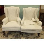A Late-Victorian wing upholstered armchair on tapering front legs and a similar wing armchair on