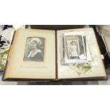 A leather-covered Holy Bible, two leather-covered photo albums, two Kelly Directories for