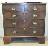 An early-19th century mahogany straight front chest of two short and three long drawers, on
