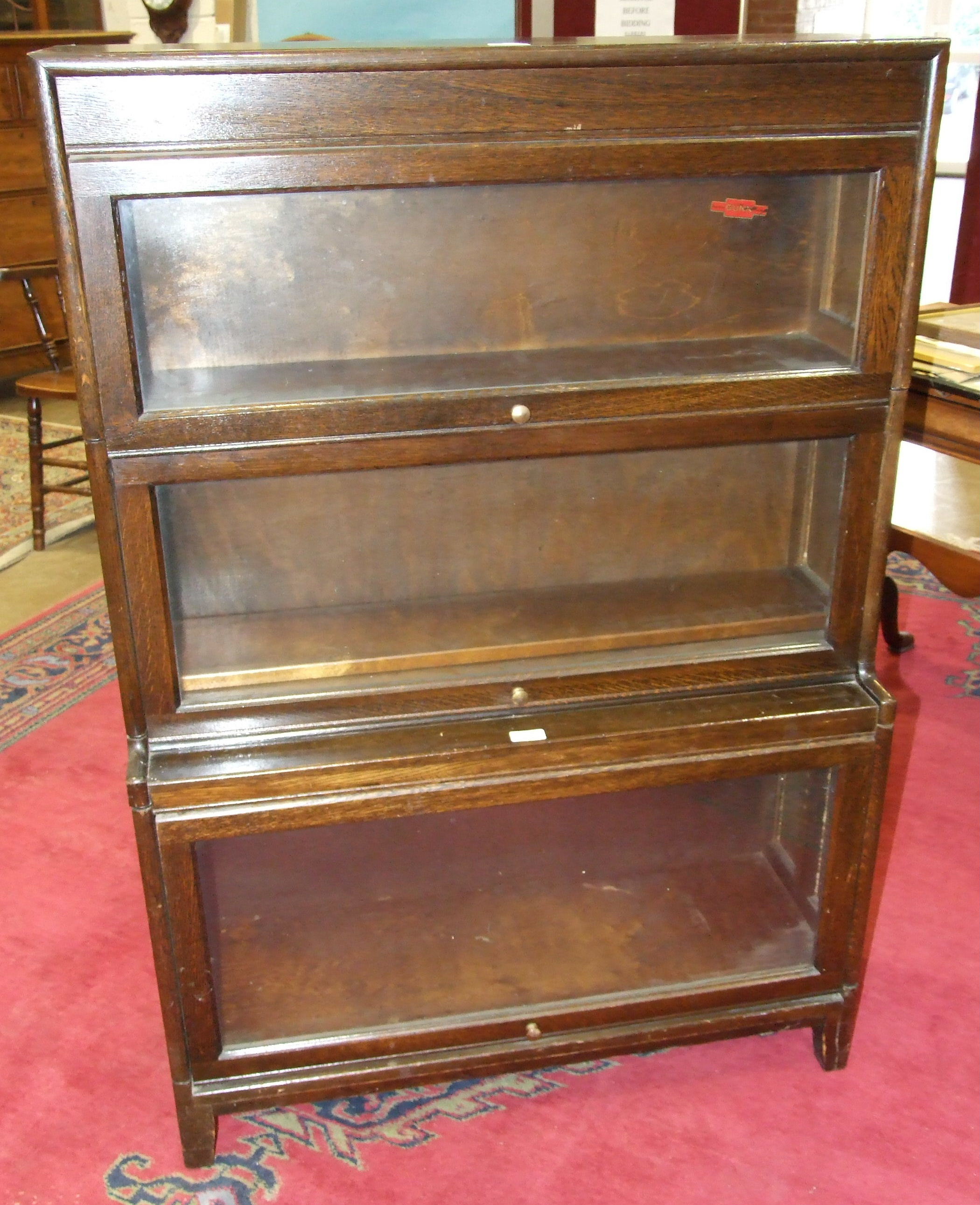 A 'Gunn' oak three-section bookcase in the Globe Wernicke style, 87cm wide, 127cm high.