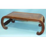 An Oriental hardwood rectangular opium table on scroll supports, 89 x 43cm.