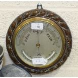 T L Ainsley Ltd, South Shields, a circular aneroid barometer/thermometer within a wooden rope-