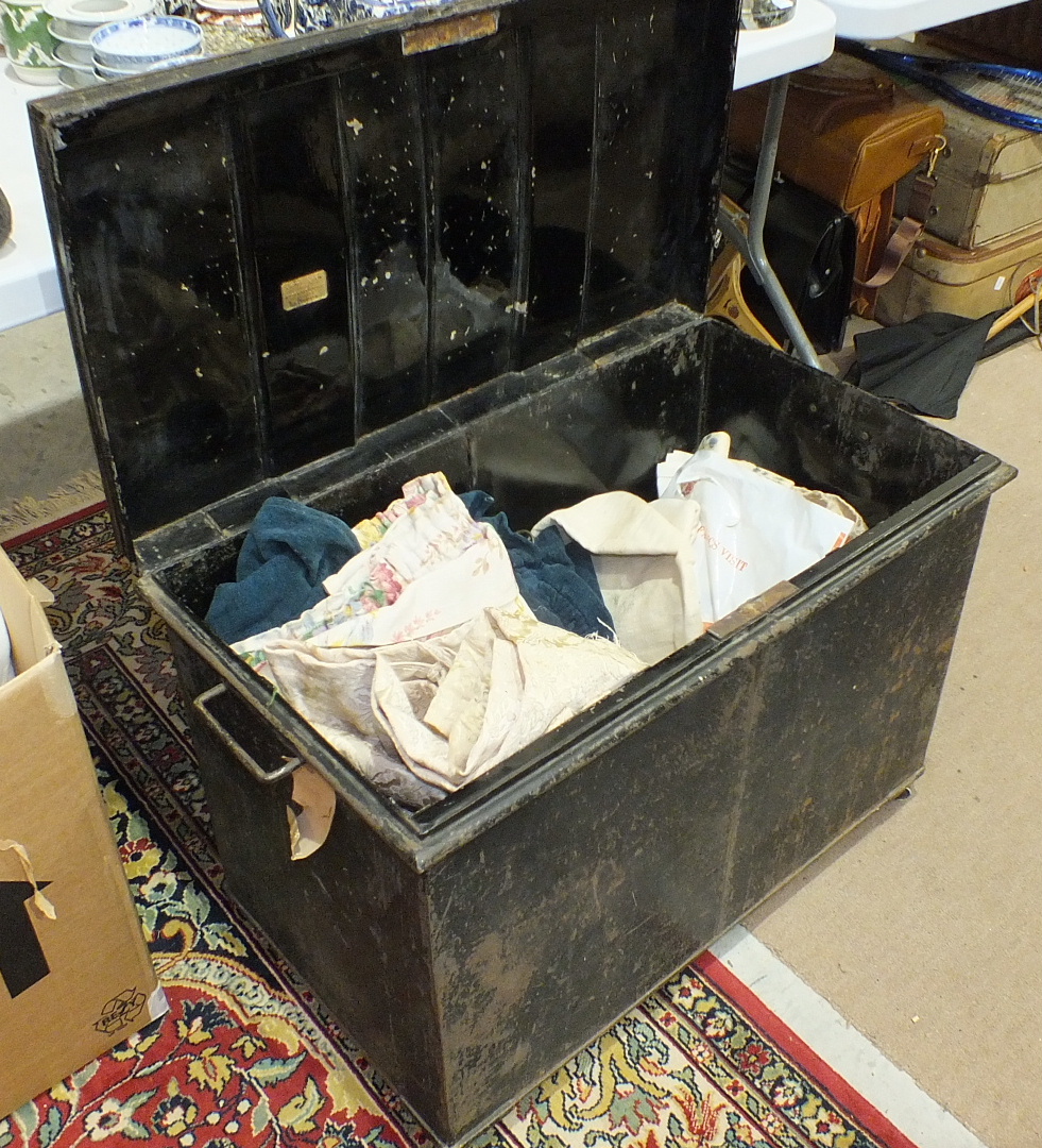 A quantity of table linen, etc. and a metal trunk.