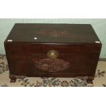 A mid-20th century camphor wood chest with carved decoration to top and front, 85cm wide, (a/f).