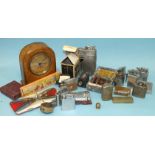A Zenith bedside timepiece in leather case, a collection of cigarette lighters and miscellaneous