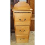 A pine narrow chest of three drawers, 40cm wide, 112cm high.