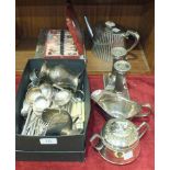 A pair of short reeded column plated candle sticks, 13cm high, a plated teapot, plated cutlery and