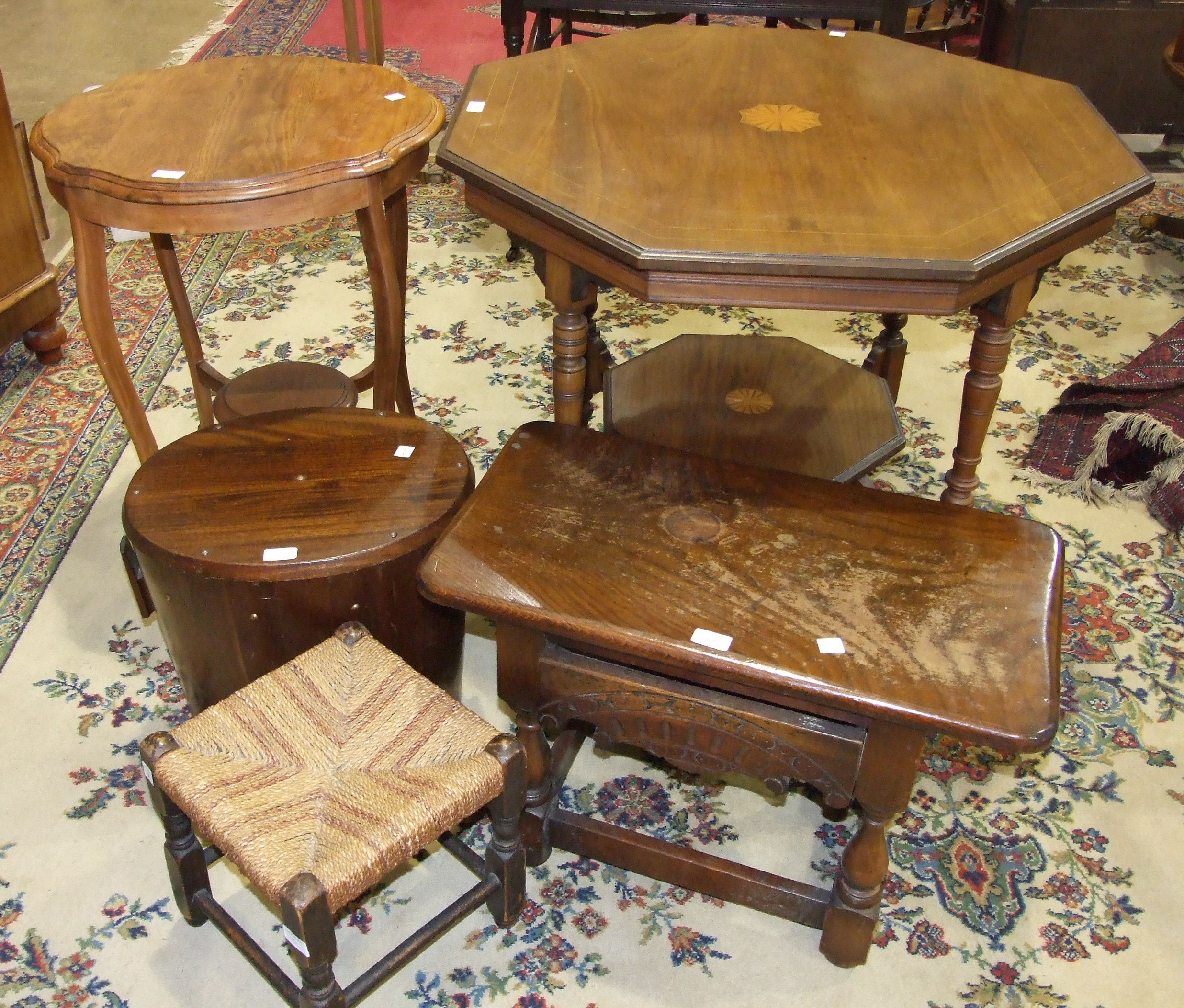 An Edwardian inlaid mahogany octagonal table on turned legs united by an undertier, 88cm high, one