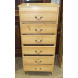 A pine narrow chest of six drawers, 58cm wide, 124cm high.