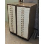 A Bisley steel fifteen-drawer cabinet, 34.5cm wide, 94cm high and a similar narrower cabinet, 27.5cm