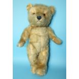 A Chiltern Hugmee musical teddy bear, c1960 with plastic nose and eyes, gold mohair plush and