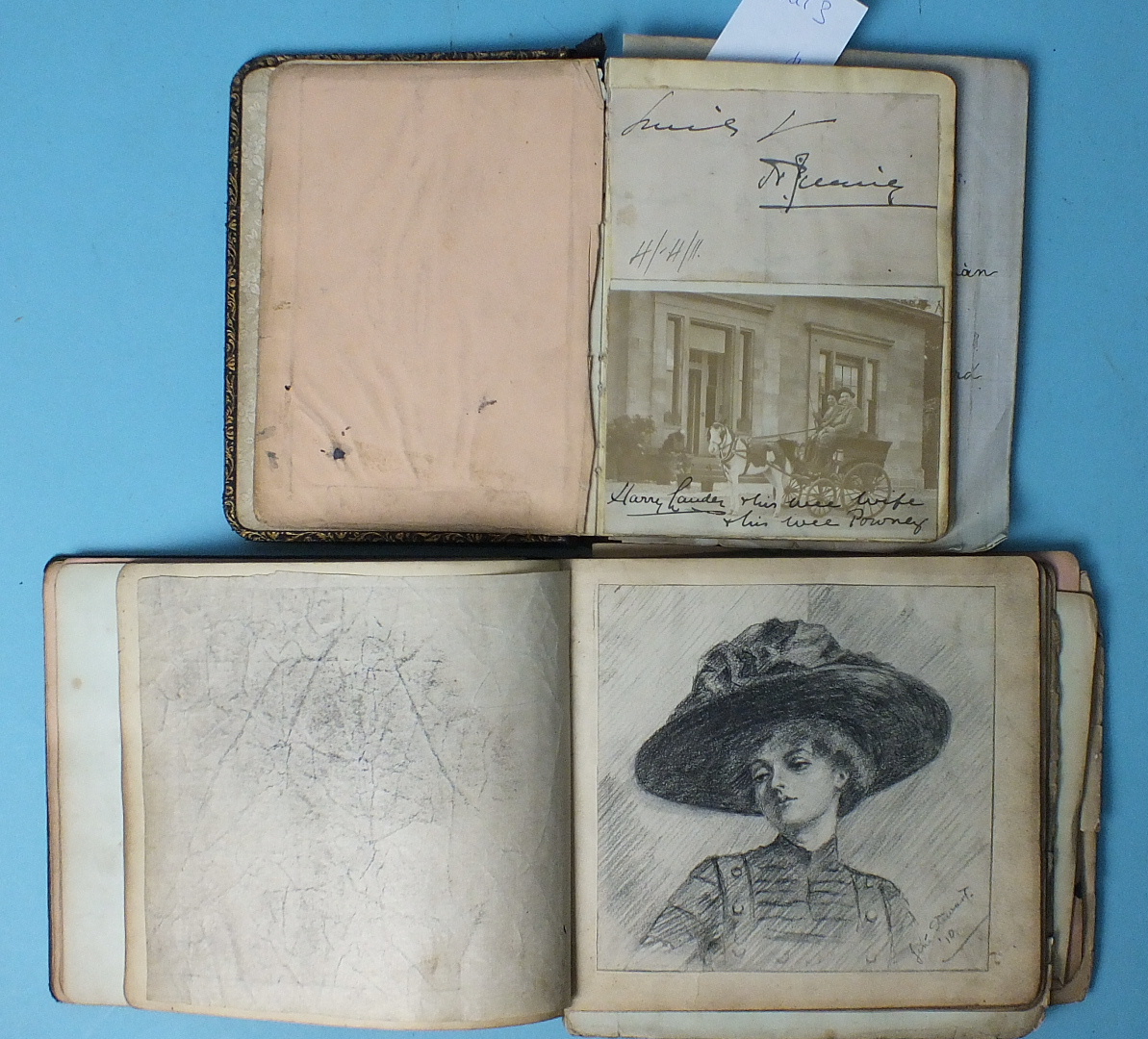 Two Edwardian autograph books containing photographs of music hall entertainers, some signed,