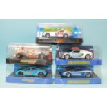 Five modern Scalextric cars by Hornby Hobbies Ltd, all in plastic boxes.