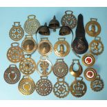 Horse brasses, a brass terret with bells and a collection of horse brasses, including two bull eyes,