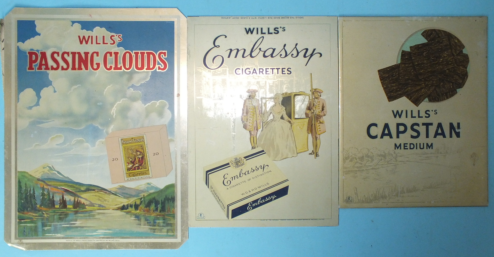 Three Will's Cigarettes tin advertising signs: "Embassy", 27 x 19cm, "Capstan Medium", 24 x 19cm and