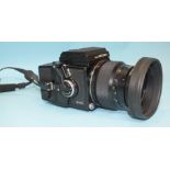 A Zenza Bronica ETR 120 medium format camera with Zenzanon MC 1:3.5 f105mm lens, paperwork and