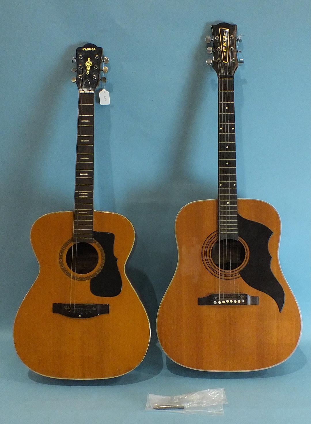 An Eko six-string acoustic guitar and a Kasuga model F-15 acoustic guitar, (2).