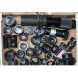 A large quantity of camera lenses, to include Canon, Praktica, Jupiter, Zeiss Jena, Nikon, Petri, (