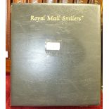 A collection of Great British smiler sheets in an album, including 2000 Christmas pair.