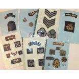 A collection of 65 cloth badges, including Home Guard, Royal Navy and RAF.